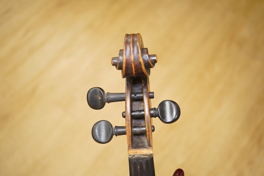 A late 19th century German violin, back measures 36cm. Condition - poor to fair